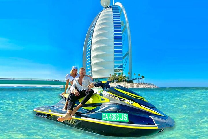 Experience the excitement of Jet Skiing around the iconic Burj Al Arab capturing stunning views of the Palm Jumeirah and Dubai's skyline while enjoying the azure waters.